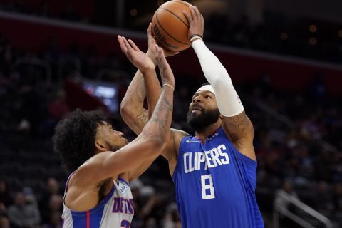 Los Angeles Clippers forward Marcus Morris Sr. (8) is defended by Detroit Pistons forward Marvin Bagley III during the first half of an NBA basketball game, Sunday, March 13, 2022, in Detroit. (AP Photo/Carlos Osorio)