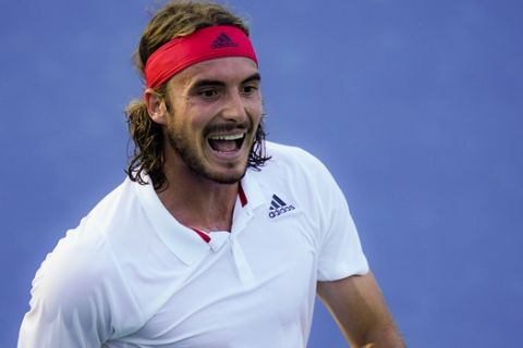 Stefanos Tsitsipas, of Greece, reacts during a match against Kevin Anderson, of South Africa, at the Western & Southern Open tennis tournament, Sunday, Aug. 23, 2020, in New York. (AP Photo/Frank Franklin II)