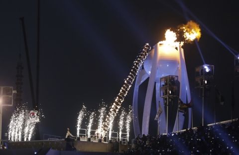 Yuna Kim lights Olympic flame during the opening ceremony of the 2018 Winter Olympics in Pyeongchang, South Korea, Friday, Feb. 9, 2018. (AP Photo/Michael Sohn)