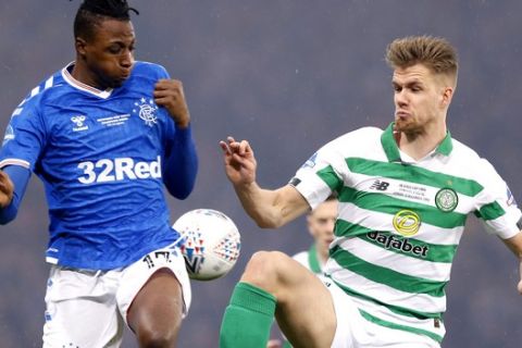 Rangers' Joe Aribo, left, and Celtic's Greg Taylor battle for the ball during the Scottish Cup Final at Hampden Park, Glasgow, Scotland, Sunday, Dec. 8, 2019. (Jeff Holmes/PA via AP)