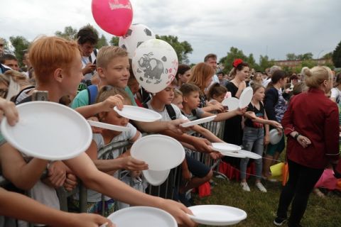 Children wait for cake at a celebration to mark Lionel Messi's birthday near Argentina's training camp base at the 2018 World Cup in Bronnitsy, Russia, Sunday, June 24, 2018. Wth a cake sculpture and a music festival the town of Bronnitsy celebrated the striker 31st birthday. (AP Photo/Ricardo Mazalan)