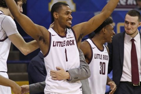 Arkansas Little Rock guard Jalen Jackson (1) and his team celebrate their win over Louisiana Monroe at the conclusion of an NCAA college basketball game in the championship of the Sun Belt Conference men's tournament in New Orleans, Sunday, March 13, 2016. (AP Photo/Max Becherer)