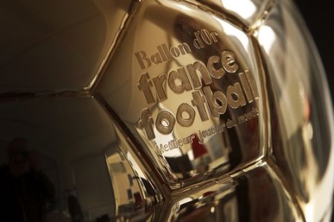 The Golden Ball is pictured in Boulogne-Billancourt, outside Paris, Friday, Sept. 21, 2018.  A woman will lift the most prestigious individual trophy in soccer for the first time this year. Awarded every year by France Football magazine since Stanley Matthews won it in 1956, the Ballon d'Or for the best player of the year will be given to both a woman and a man on Dec. 3 in Paris. (AP Photo/Christophe Ena)