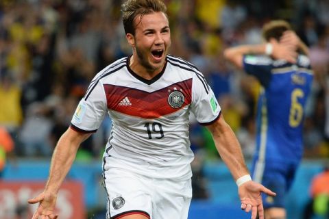 RIO DE JANEIRO, BRAZIL - JULY 13: Mario Goetze of Germany celebrates scoring his team's first goal in extra time during the 2014 FIFA World Cup Brazil Final match between Germany and Argentina at Maracana on July 13, 2014 in Rio de Janeiro, Brazil.  (Photo by Jamie McDonald/Getty Images)