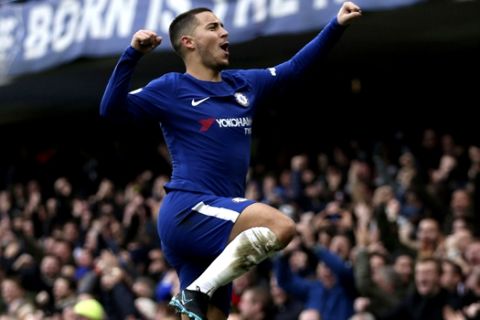 Chelsea's Eden Hazard celebrates scoring his side's first goal of the game during the English Premier League soccer match between Chelsea and Newcastle United at Stamford Bridge, London. Saturday. Dec. 2, 2017. (Steven Paston/PA via AP)