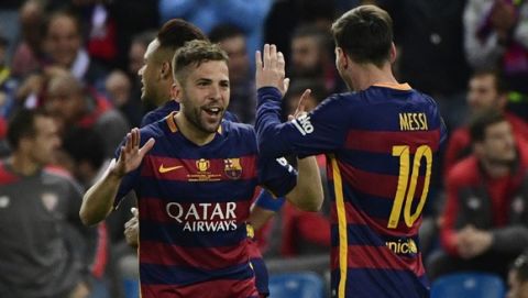 Barcelona's defender Jordi Alba (L) and Barcelona's Argentinian forward Lionel Messi celebrate a goal during the Spanish "Copa del Rey" (King's Cup) final match FC Barcelona vs Sevilla FC at the Vicente Calderon stadium in Madrid on May 22, 2016. / AFP / PIERRE-PHILIPPE MARCOU        (Photo credit should read PIERRE-PHILIPPE MARCOU/AFP/Getty Images)