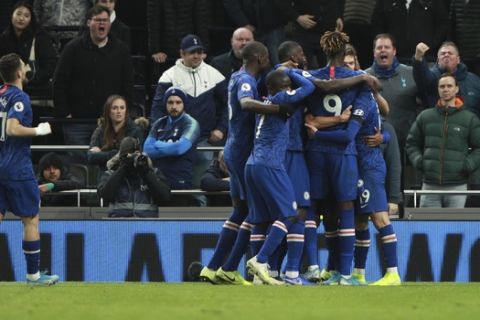 Chelsea players celebrate after Willian scored his side's second goal during the English Premier League soccer match between Tottenham Hotspur and Chelsea, at the Tottenham Hotspur Stadium in London, Sunday, Dec. 22, 2019. (AP Photo/Ian Walton)
