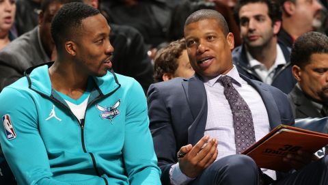 CHARLOTTE, NC - DECEMBER 4: Dwight Howard #12 talks with Assistant Coach Mike Batiste of the Charlotte Hornets during the game against the Orlando Magic on December 4, 2017 at Spectrum Center in Charlotte, North Carolina. NOTE TO USER: User expressly acknowledges and agrees that, by downloading and/or using this photograph, user is consenting to the terms and conditions of the Getty Images License Agreement. Mandatory Copyright Notice:  Copyright 2017 NBAE (Photo by Kent Smith/NBAE via Getty Images)