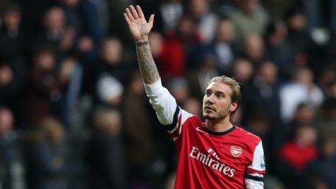 Arsenal's Nicklas Bendtner celebrates the victory over Newcastle United at the end of their English Premier League soccer match at St James' Park, Newcastle, England, Sunday, Dec. 29, 2013. (AP Photo/Scott Heppell)