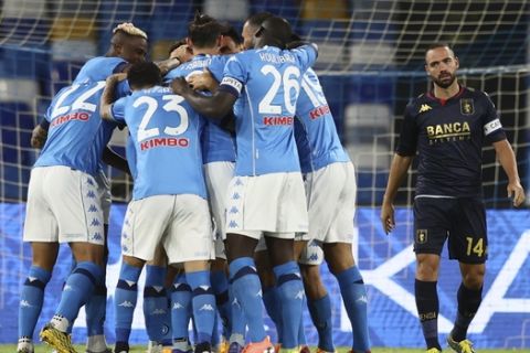 Napoli's players celebrate Piotr Zielinski's goal during the Serie A soccer match between Napoli and Genoa at the San Paolo Stadium in Naples, Italy, Sunday, Sept. 27, 2020. (Alessandro Garofalo/LaPresse via AP)