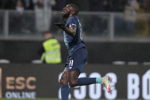 In this photo taken on Sunday, Feb. 16, 2020, Porto's Moussa Marega celebrates after scoring his side's second goal during a Portuguese league soccer match between Vitoria SC and FC Porto in Guimaraes, Portugal. The president and the prime minister of Portugal added their voices to a national outcry over racist abuse aimed at Marega. (AP Photo)