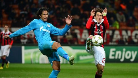 AC Milan's Spanish forward Bojan Krkic  (R) fights for the ball with FC Zenit's Portuguese defender Bruno Alves during the Champions league match between AC Milan and Zenith St Petersburg on December 4, 2012 at the San Siro stadium in Milan. AFP PHOTO / OLIVIER MORIN        (Photo credit should read OLIVIER MORIN/AFP/Getty Images)