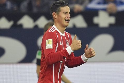 Bayern's James Rodriguez celebrates after scoring during the German Bundesliga soccer match between FC Schalke 04 and Bayern Munich at the Arena in Gelsenkirchen, Germany, Tuesday, Sept. 19, 2017. (AP Photo/Martin Meissner)