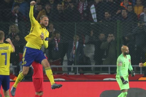Sweden's Andreas Granqvist, centre left, celebrates after scoring his side's opening goal during the UEFA Nations League soccer match between Turkey and Sweden in Konya, Turkey, Saturday, Nov. 17, 2018. (AP Photo)
