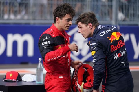 Ferrari driver Charles Leclerc of Monaco speaks with Red Bull driver Max Verstappen of the Netherlands following qualifying for the Formula One Miami Grand Prix auto race at the Miami International Autodrome, Saturday, May 7, 2022, in Miami Gardens, Fla. Leclerc will start in pole position in tomorrow's F1 race and Verstappen in the third. (AP Photo/Darron Cummings)