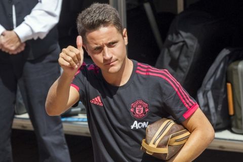 Manchester United midfielder Ander Herrera gives a thumbs up to fans after stepping off the team bus before an International Champions Cup soccer match against Liverpool at Michigan Stadium, Saturday, July 28, 2018, in Ann Arbor, Mich. (AP Photo/Tony Ding)