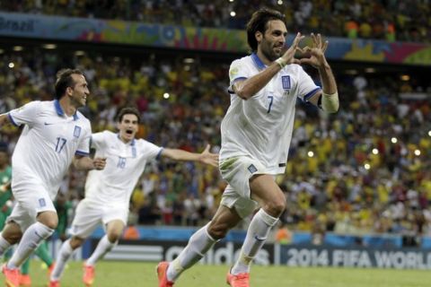 Greece's Giorgos Samaras celebrates scoring his side's 2nd goal from the penalty spot during the group C World Cup soccer match between Greece and Ivory Coast at the Arena Castelao in Fortaleza, Brazil, Tuesday, June 24, 2014. (AP Photo/Natacha Pisarenko)
