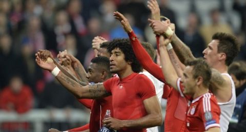 Bayern Munich's players react after the UEFA Champions League quarter-final second leg football match Bayern Munich vs Manchester United in Munich, southern Germany, on April 9, 2014.  Bayern won 3-1.     AFP PHOTO / JOHANNES EISELE        (Photo credit should read JOHANNES EISELE/AFP/Getty Images)