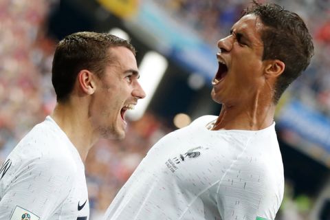 France's Raphael Varane, right, and Antoine Griezmann celebrate after Varane scored his side's first goal during the quarterfinal match between Uruguay and France at the 2018 soccer World Cup in the Nizhny Novgorod Stadium, in Nizhny Novgorod, Russia, Friday, July 6, 2018. (AP Photo/Petr David Josek)