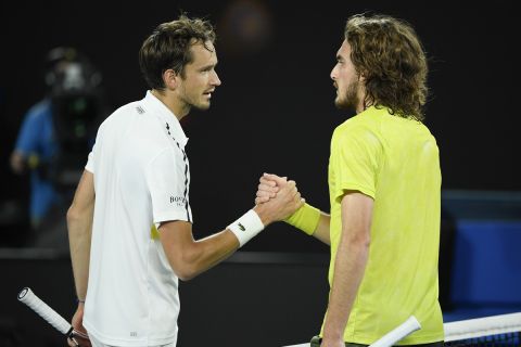 Russia's Daniil Medvedev, left, is congratulated by Greece's Stefanos Tsitsipas after winning their semifinal match at the Australian Open tennis championship in Melbourne, Australia, Friday, Feb. 19, 2021.(AP Photo/Andy Brownbill)