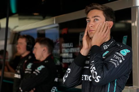 Mercedes driver George Russell of Britain, closes his ears as he stands on the pit lane, during practice for the Formula One Abu Dhabi Grand Prix, in Abu Dhabi, United Arab Emirates Friday, Nov. 18, 2022. (AP Photo/Hussein Malla)