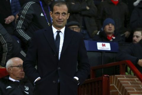 Juventus coach Massimiliano Allegri stands by the bench during the Champions League group H soccer match between Manchester United and Juventus at Old Trafford, Manchester, England, Tuesday, Oct. 23, 2018. (AP Photo/Dave Thompson)