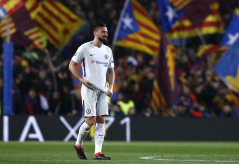 Chelsea's Olivier Giroud reacts after Barcelona's Lionel Messi scored his side's third goal during the Champions League round of sixteen second leg soccer match between FC Barcelona and Chelsea at the Camp Nou stadium in Barcelona, Spain, Wednesday, March 14, 2018. (AP Photo/Manu Fernandez)