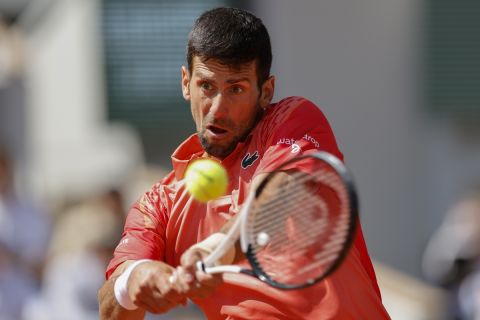 Serbia's Novak Djokovic plays a shot against Aleksandar Kovacevic of the U.S. during their first round match of the French Open tennis tournament at the Roland Garros stadium in Paris, Monday, May 29, 2023. (AP Photo/Jean-Francois Badias)