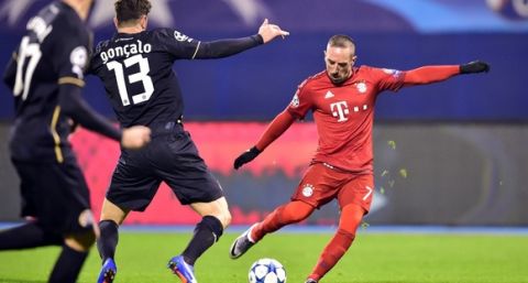 Bayern Munich's French midfielder Franck Ribery (R) shoots the ball during the UEFA Champions League football match between Dinamo Zagreb v Bayern Munich at the Maksimir stadium in Zagreb on December 9, 2015. AFP PHOTO / ANDREJ ISAKOVIC / AFP / ANDREJ ISAKOVIC        (Photo credit should read ANDREJ ISAKOVIC/AFP/Getty Images)