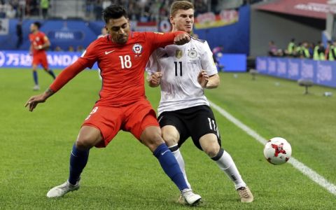 Chile's Gonzalo Jara clashes with Germany's Timo Werner, right, during the Confederations Cup final soccer match between Chile and Germany, at the St.Petersburg Stadium, Russia, Sunday July 2, 2017. (AP Photo/Thanassis Stavrakis)