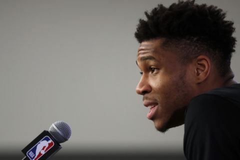 Milwaukee Bucks' Giannis Antetokounmpo gives a press conference ahead of the NBA basketball game against Charlotte Hornets, in Paris, Thursday, Jan. 23, 2020. (AP Photo/Thibault Camus)