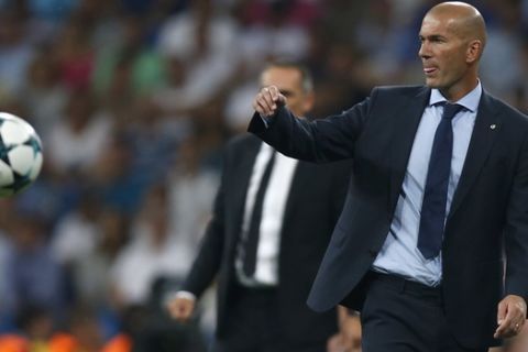 Real Madrid coach Zinedine Zidane reacts during a Champions League group H soccer match between Real Madrid and Apoel Nicosia at the Santiago Bernabeu stadium in Madrid, Spain, Wednesday, Sept. 13, 2017. (AP Photo/Francisco Seco)