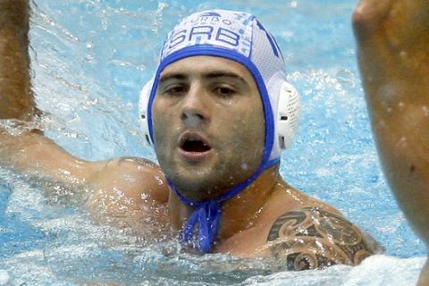 Serbia's Aleksandar Sapic holds the ball during the men's FINA Water Polo World League Final between Serbia and Hungary in Berlin, Sunday Aug. 12, 2007. Serbia defeated Hungary by 9-6. (AP Photo/Michael Sohn) 