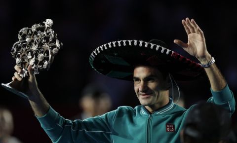 Roger Federer of Switzerland waves to cheering fans after defeating Germany's Alexander Zverev in an exhibition tennis match at Plaza de Toros bullring in Mexico City, Saturday, Nov. 23, 2019. Saturday's match was the fourth stop in a tour of Latin America by the tennis greats. (AP Photo/Rebecca Blackwell)