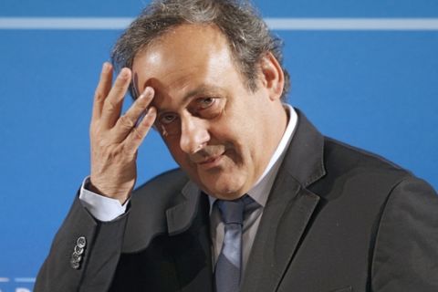 FILE - In this Feb.22, 2014 file photo, UEFA President Michel Platini arrives at a press conference, one day prior to the UEFA EURO 2016 qualifying draw in Nice, southeastern France. The Court of Arbitration for Sport, CAS, in Lausanne, Switzerland, plans to announce its verdict on Monday, May 9, 2016 in Michel Platini's appeal on his six-year ban from football. (AP Photo/Lionel Cironneau, file)