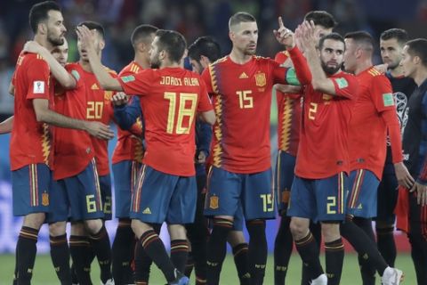 Spain players celebrate after the group B match between Spain and Morocco at the 2018 soccer World Cup at the Kaliningrad Stadium in Kaliningrad, Russia, Monday, June 25, 2018. (AP Photo/Petr David Josek)