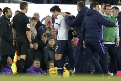 Tottenham Hotspur's Son Heung-min reacts as he is sent off for a challenge on Everton's Andre Gomes during the English Premier League soccer match at Goodison Park, Liverpool, England, Sunday Nov. 3, 2019. (Nick Potts/PA via AP)