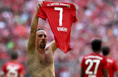 Bayern's Franck Ribery lifts his jersey after scoring his side's 4rth goal during the German Bundesliga soccer match between FC Bayern Munich and Eintracht Frankfurt in Munich, Germany, Saturday, May 18, 2019. (AP Photo/Matthias Schrader)