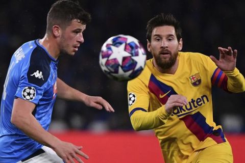 Diego Demme of Napoli in action against Lionel Messi of Barcelona, right, during their Champions League, Round of 16, first-leg soccer match between Napoli and Barcelona, at the San Paolo Stadium in Naples, Italy, Tuesday, Feb. 25, 2020. (Alfredo Falcone/LaPresse Via AP)