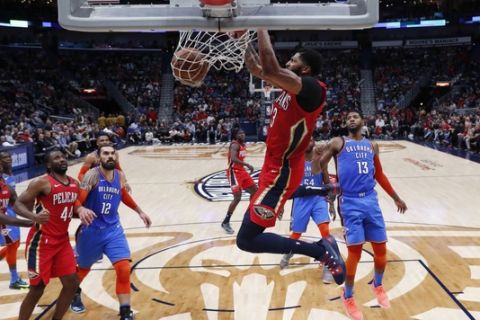 New Orleans Pelicans forward Anthony Davis dunks in the first half of an NBA basketball game against the Oklahoma City Thunder in New Orleans, Wednesday, Dec. 12, 2018. (AP Photo/Gerald Herbert)