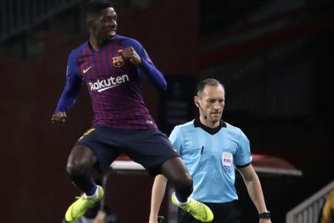 Barcelona forward Ousmane Dembele celebrates after scoring the opening goal during the Champions League group B soccer match between FC Barcelona and Tottenham Hotspur at the Camp Nou stadium in Barcelona, Spain, Tuesday, Dec. 11, 2018. (AP Photo/Emilio Morenatti)