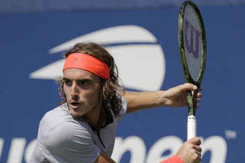 Stefanos Tsitsipas, of Greece, returns to Daniil Medvedev, of Russia, during the second round of the U.S. Open tennis tournament, Wednesday, Aug. 29, 2018, in New York. (AP Photo/Kevin Hagen)
