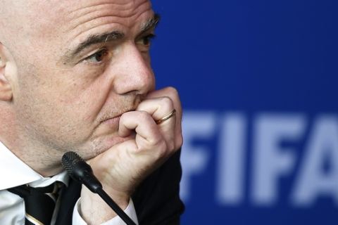 FIFA President Gianni Infantino listens to a reporter's question during a press conference after the FIFA Council Meeting, in Bogota, Colombia, Friday, March, 16, 2018. FIFA has finally and fully approved video review to help referees at the World Cup. The last step toward giving match officials high-tech help in Russia was agreed to on Friday by FIFA's ruling council chaired by Infantino. (AP Photo/Fernando Vergara)