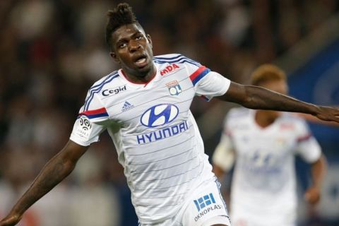 Lyon's French Cameroonian defender Samuel Umtiti reacts after scoring an equalizer during the French L1 football match Paris Saint-Germain (PSG) vs Lyon (OL) on September 21, 2014 at the Parc des Princes stadium in Paris. AFP PHOTO / KENZO TRIBOUILLARD        (Photo credit should read KENZO TRIBOUILLARD/AFP/Getty Images)