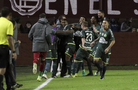 Brazil's Chapecoense's players celebrate after teammate Luiz Otavio, not in picture, scored a goal against Argentina's Lanus during a Copa Libertadores Group 6 soccer match in Buenos Aires, Argentina, Wednesday, May 17, 2017.(AP Photo/Agustin Marcarian)