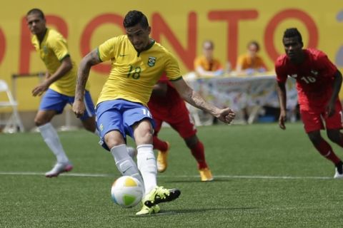 Brazil's Luciano Da Rocha scores from penalty kick against Panama during the second half of their bronze medal Pan Am Games soccer game Saturday, July 25, 2015, in Toronto. (AP Photo/Gregory Bull)