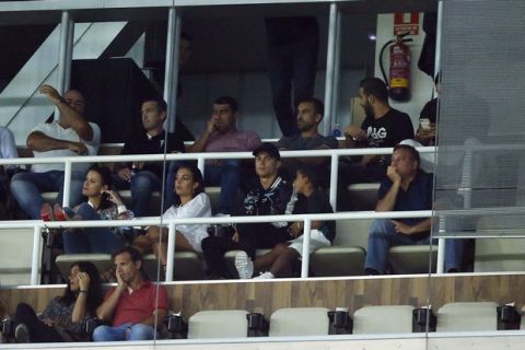 Real Madrid's Cristiano Ronaldo, middle row centre, sits in the stand watching the Spanish Super Cup second leg soccer match between Real Madrid and Barcelona at the Santiago Bernabeu stadium in Madrid, Thursday, Aug. 17, 2017. (AP Photo/Francisco Seco)