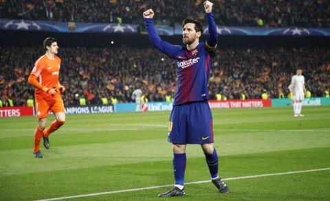 Barcelona's Lionel Messi celebrates after scoring his side's third goal as Chelsea goalkeeper Thibaut Courtois, left, stands defeated during the Champions League round of sixteen second leg soccer match between FC Barcelona and Chelsea at the Camp Nou stadium in Barcelona, Spain, Wednesday, March 14, 2018. (AP Photo/Emilio Morenatti)