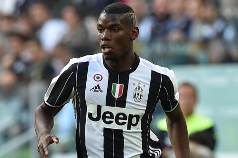 TURIN, ITALY - MAY 14:  Paul Pogba of Juventus FC in action during the Serie A match between Juventus FC and UC Sampdoria at Juventus Arena on May 14, 2016 in Turin, Italy.  (Photo by Valerio Pennicino/Getty Images)