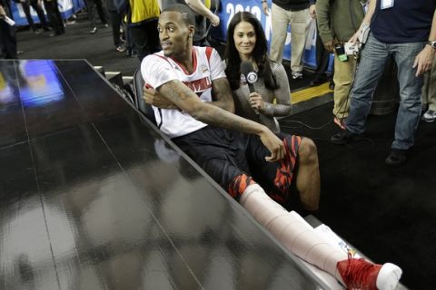 Louisville's Kevin Ware sits on the bench at the court before the first half of the NCAA Final Four tournament college basketball semifinal game against Wichita State, Saturday, April 6, 2013, in Atlanta. (AP Photo/David J. Phillip)